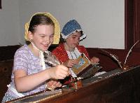 Kids work as they would have back when during the Bullet Hill School anniversary celebration.
