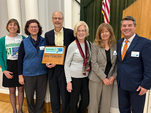 group photo with sustainable ct plaque