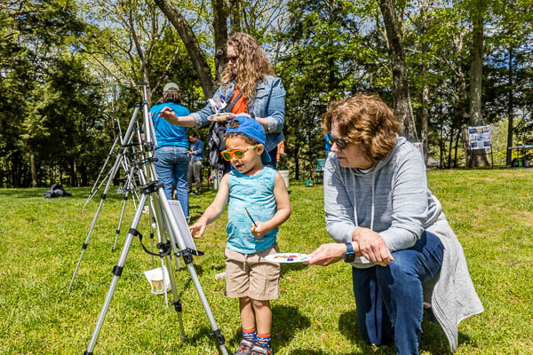 child and adult painting