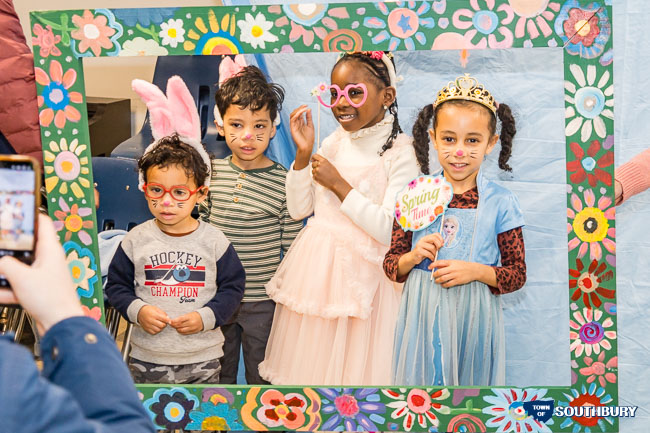 kids in a spring frame posing for a picture