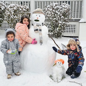 kids with a snowman